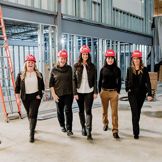 West Michigan Women in construction walking on job site around the Greater Grand Rapids Area